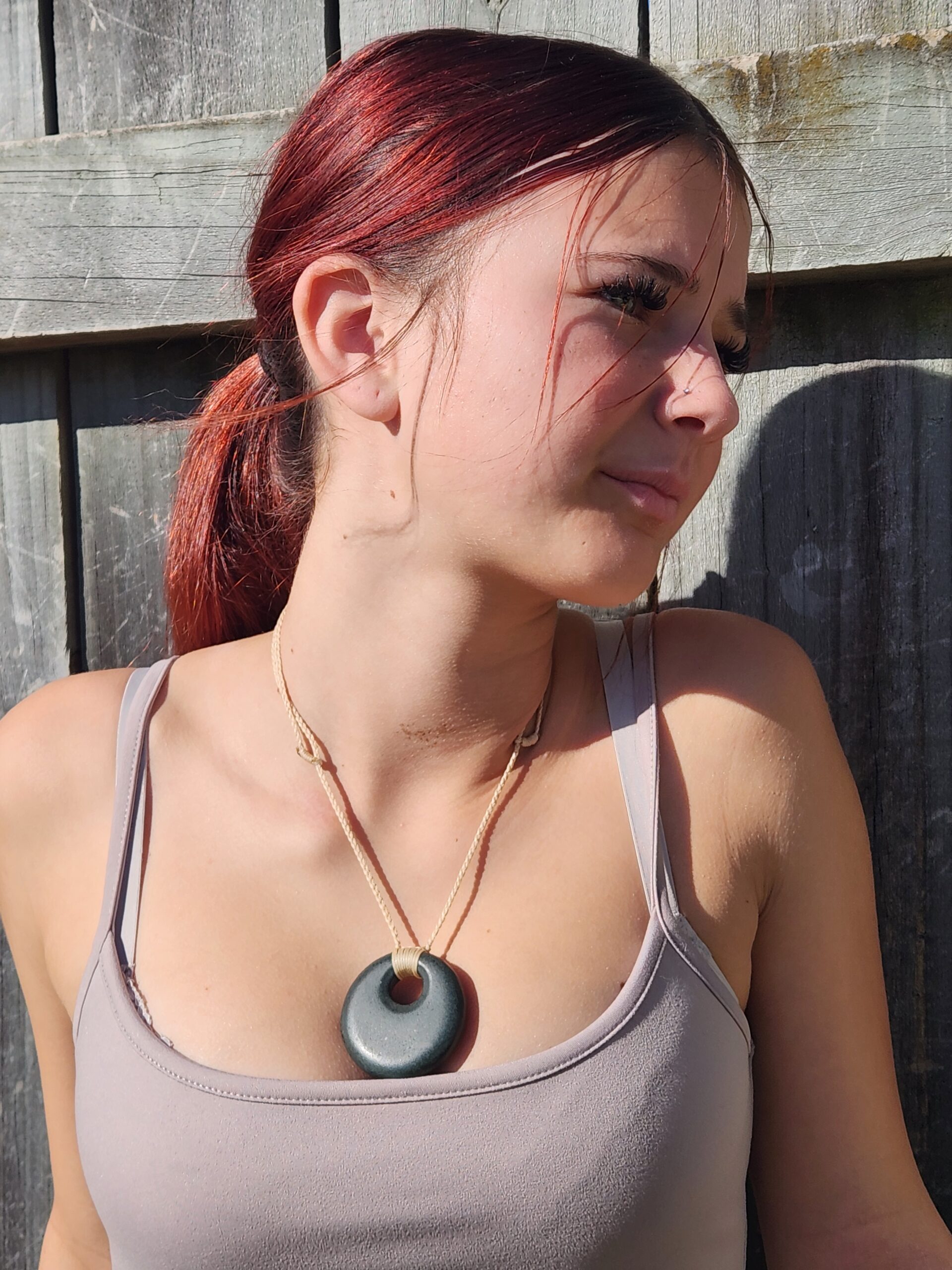 stone pendant show being worn